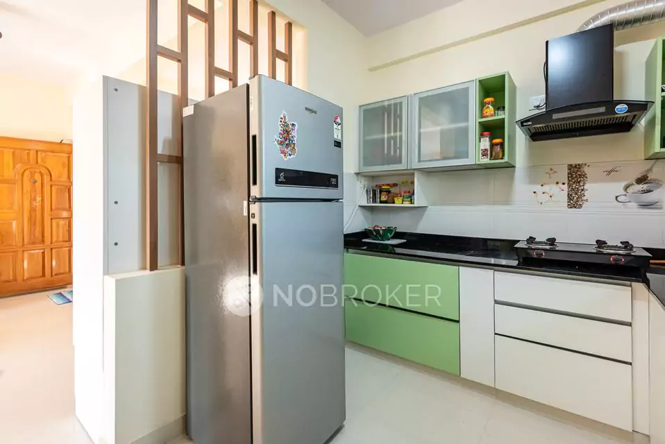 Contemporary Indian Kitchen with Green and White Cabinets